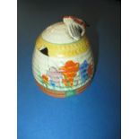 A 1930s Clarice Cliff autumn Crocus beehive honey pot