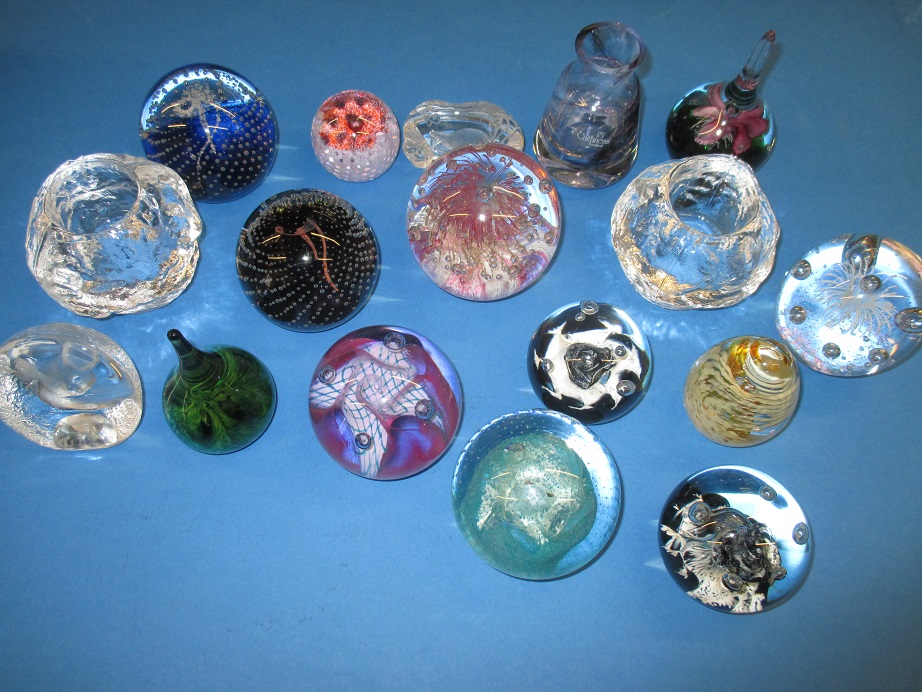 A large quantity of vintage glass paperweights to include examples by Kosta Boda