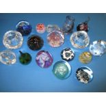 A large quantity of vintage glass paperweights to include examples by Kosta Boda