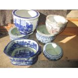 A quantity of blue and white pottery planters and a foot bath