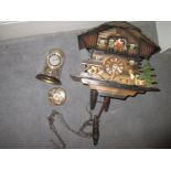 A vintage cuckoo clock and 2 others