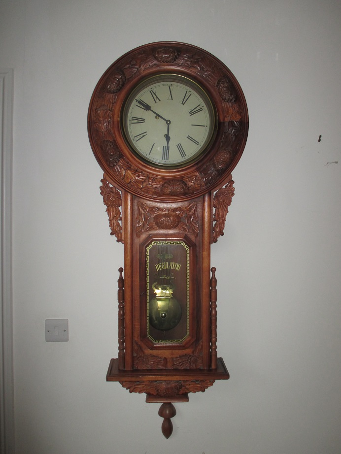 A large tavern style walnut cased regulator clock
