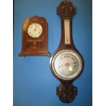 A vintage inlaid mantle clock and a barometer