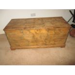 An antique pine blanket box