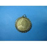 An 1897 gold half sovereign in 9ct gold loose fit coin mount