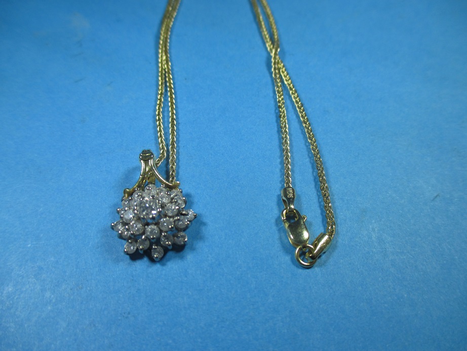 A 14ct gold necklace with a diamond set pendant