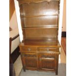 A small oak dresser with plate rack