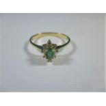 A 14ct gold diamond and emerald ring, approx ring size P