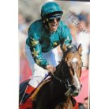 A genuine hand signed autographed picture of Frankie Dettori