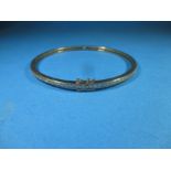 An 18ct gold diamond set bangle, approx weight 14g