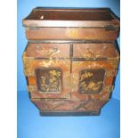 A vintage Chinese lacquer ware collectors cabinet