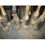 9 bottles of vintage champagne and sparkling wine. Register and bid at https://c