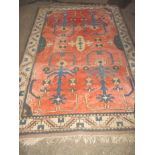 A vintage Turkish hand woven wool rug, approx size 12ft6" x 5ft6"