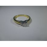 An 18ct gold and platinum diamond solitaire ring the stone being .25ct, approx r