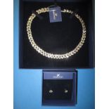 A Swarovski necklace and a pair of earrings in original boxes