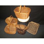 A quantity of wicker baskets a stool and leather bag