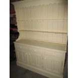 A painted pine dresser with rack