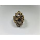 A 9ct filigree gold cluster ring set with garnets, approx ring size M