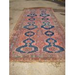 A large Persian hand woven wool rug, approx size 14ft x 7ft