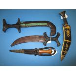 An African tribal arm dagger, 2 Sudanese daggers and a Khukuri with inlaid scabbard