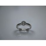 An 18ct white gold diamond solitaire ring, approx finger size J