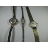 Three 9ct gold cased watches, two with gold straps