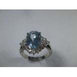 A platinum diamond and aquamarine cocktail ring, approx finger size L