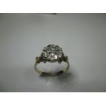 An 18ct yellow gold diamond cluster ring, approx finger size S