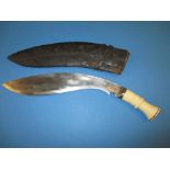 An antique bone handled Khukuri with gold half moon in set to blade, with scabbard