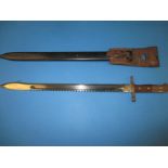 A vintage bayonet sword in scabbard the blade marked Waffenfabrik Neuhausen, approx. length 64cm