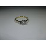 An 18ct gold and platinum diamond solitaire ring, approx. ring size O