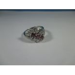 A 585 white gold diamond and ruby ring, approx. ring size O