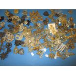 A large quantity of vintage military badges