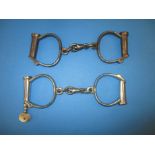 2 pairs of vintage handcuffs