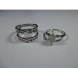 A 10ct white gold diamond set pair of rings, approx finger size J1/2