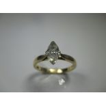 An 18ct gold ring set with a marquise cut 0.52ct solitaire diamond of G colour and VS Clarity,