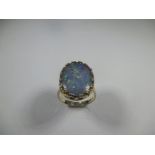 A 9ct yellow gold ring set with a large opal duplet, approx finger size P 1/2