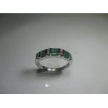 A white gold diamond and emerald ring, approx finger size M