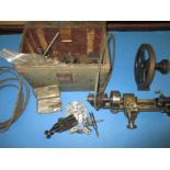 A watch makers lathe with tools and numerous accessories