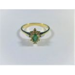 A 14ct gold diamond and emerald ring, approx finger size P