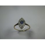An unmarked gold diamond and sapphire boat shaped ring, approx finger size T 1/2