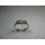An 18ct gold and platinum 3 stone diamond ring, approx finger size L