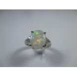 An art deco style platinum diamond and opal ring, approx finger size J
