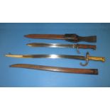 Two vintage sword bayonets in scabbards