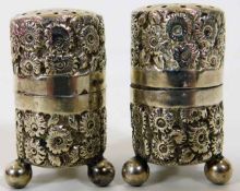 A decorative small pair of Chester silver pepper p