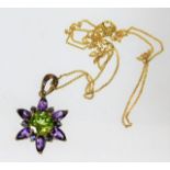 A 9ct gold pendant set with amethyst, peridot & sa