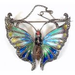 A white metal enamelled butterfly brooch, instinct