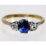 A 9ct gold ring with platinum set sapphire & appro