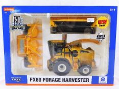 A boxed diecast model Ertl FX60 forage harvester