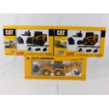 Two boxed CAT & one JCB heavy machinery models